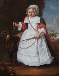 Een jonge jongen met een geit